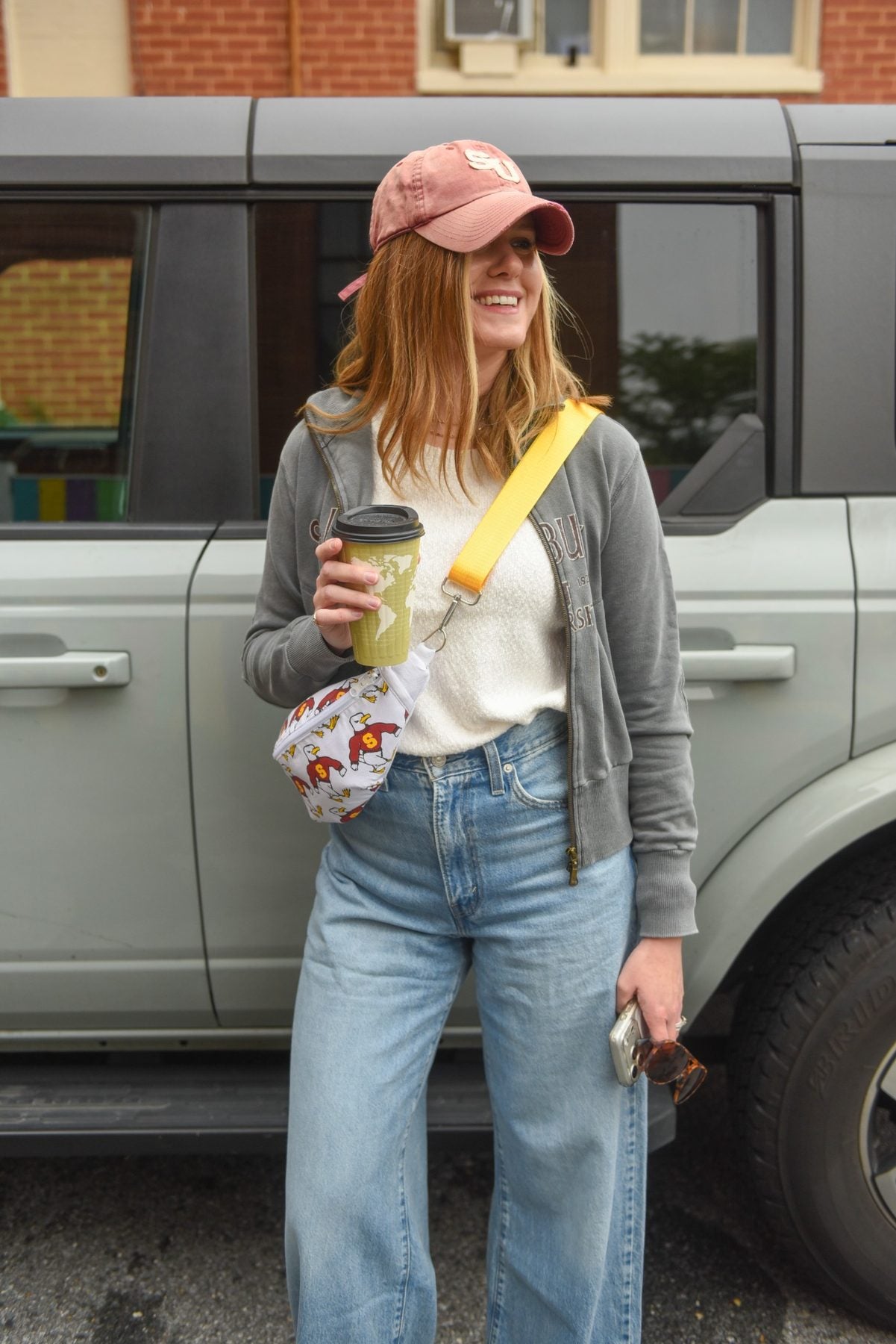 Salisbury-themed reversible Switch Purse sling bag styled for a casual coffee outing