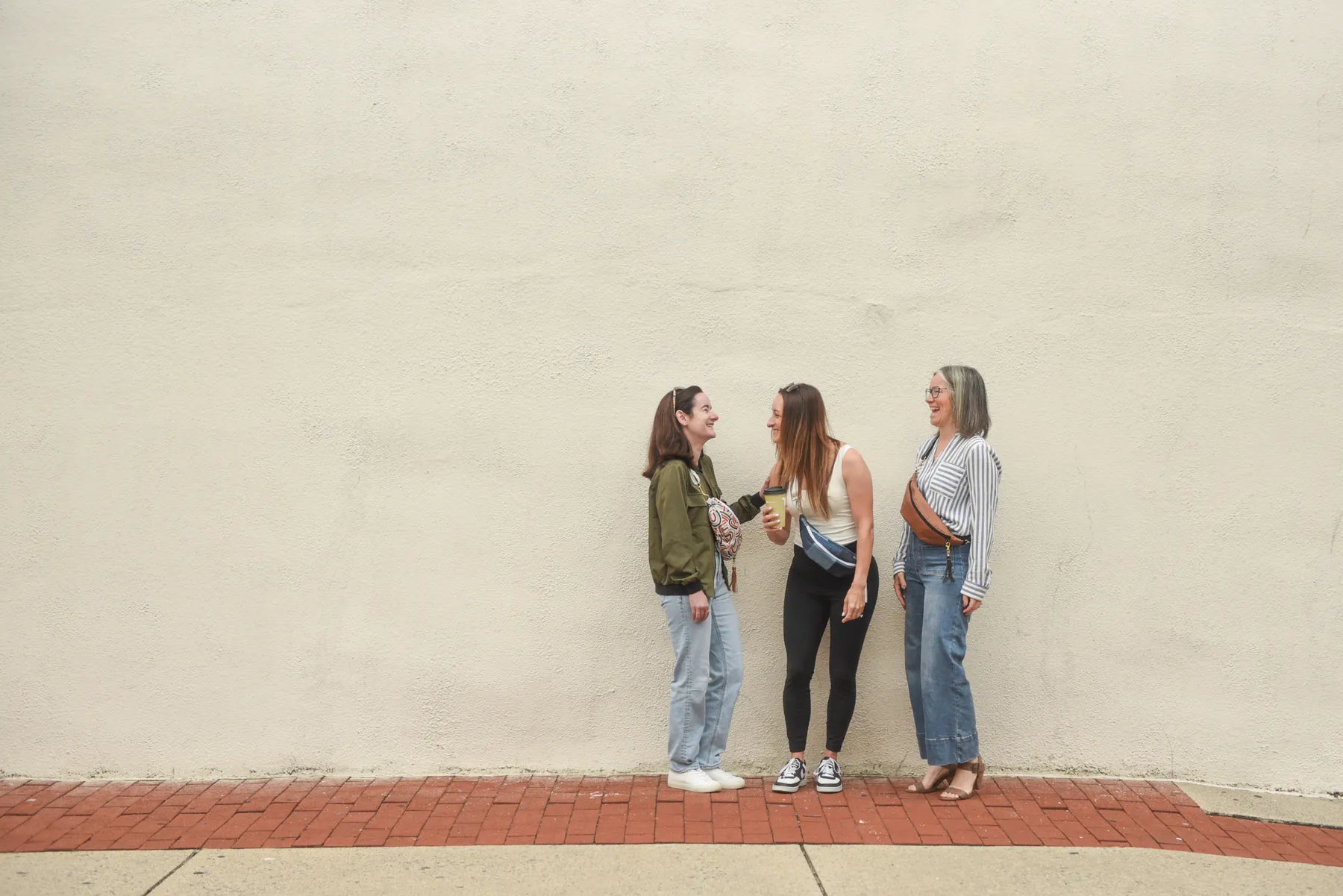 Lifestyle image of handmade reversible Switch Purse sling bags worn for hands-free everyday carry